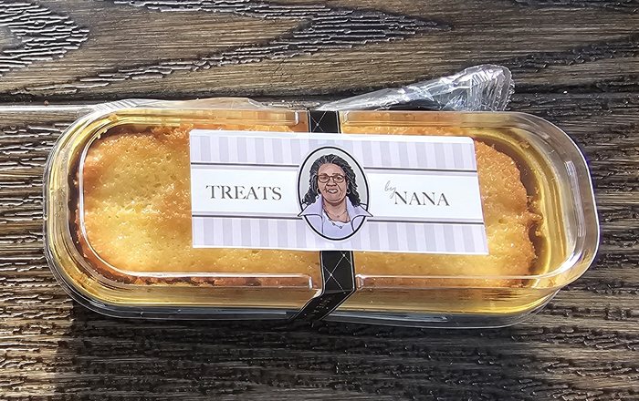 Five Flavor Pound Cake loaf in a Treats by Nana labeled container