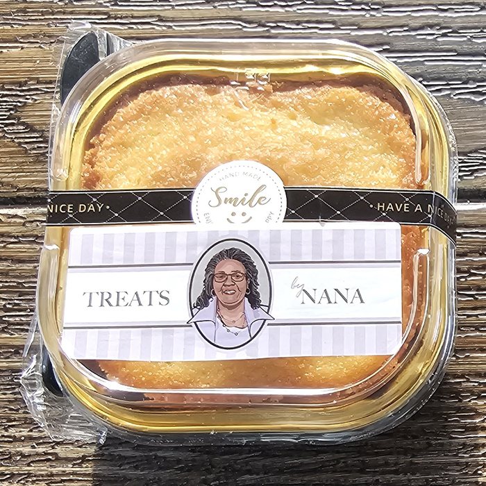 The Perfect Mini pound cake in a labeled Treats by Nana container